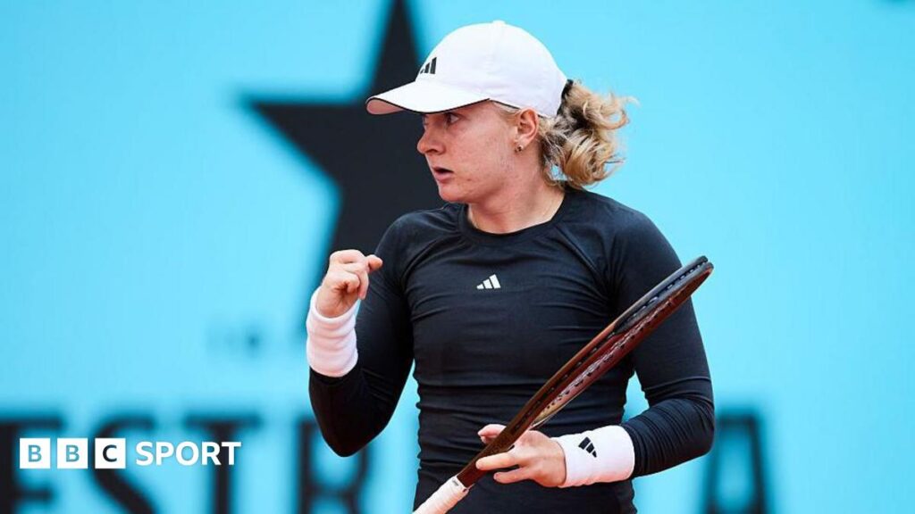 Francesca Jones holds a tennis racquet