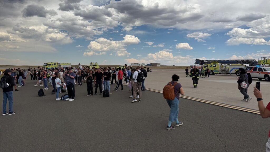 Passengers evacuated after American Airlines plane catches fire at Denver Airport