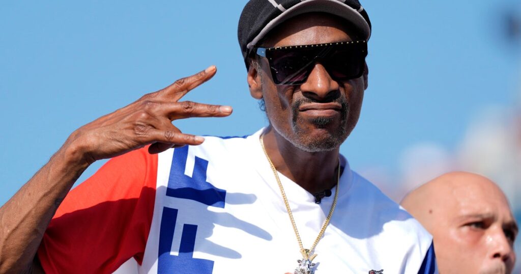 Snoop Dogg becomes co-owner of Swansea City soccer team, calls it an "underdog that bites back, just like me."