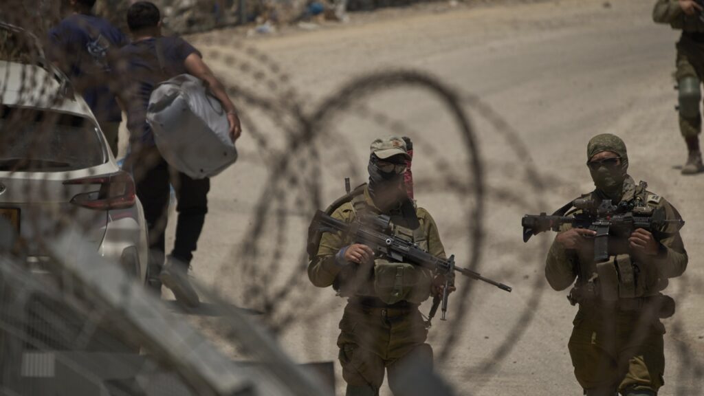 Syrian forces who fought Druze militias leave Sweida province under a ceasefire : NPR