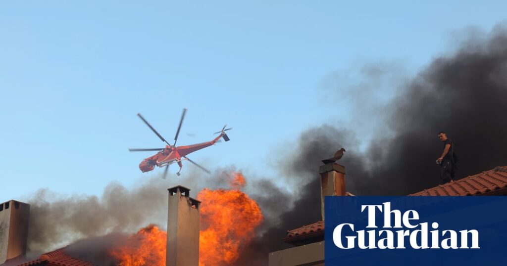 Wildfire burns through northern suburb of Athens as residents told to evacuate | Greece