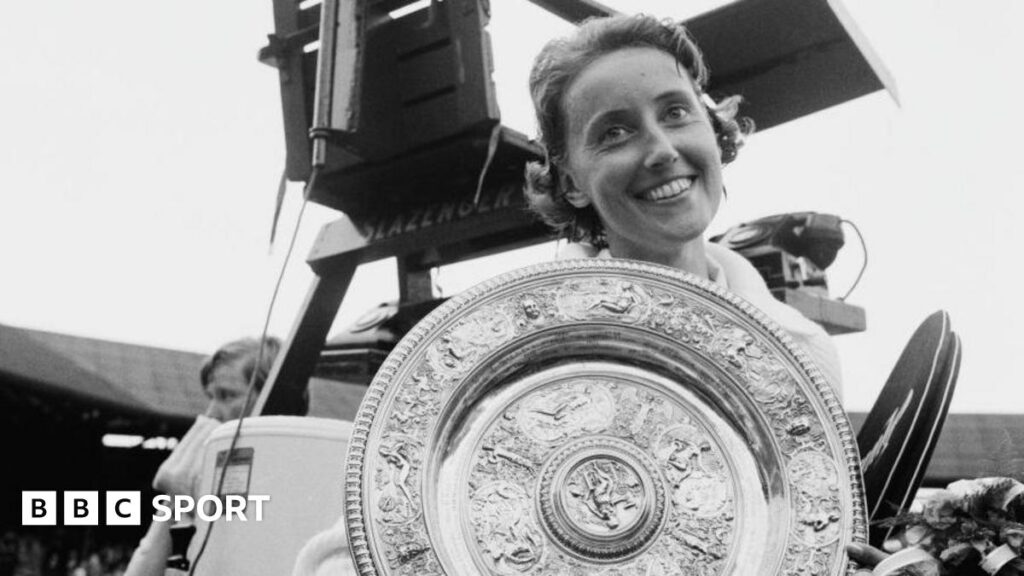 A smiling Angela Mortimer, as she was known then, holds the Venus Rosewater Dish after her victory in the all-British 1961 Wimbledon final