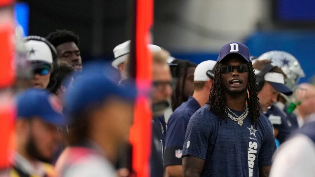 CeeDee Lamb, in street garb, flagged after getting hit by official on sideline
