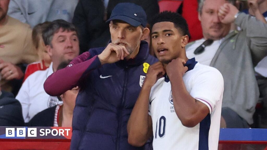 Thomas Tuchel, Head Coach of England, speaks to Jude Bellingham