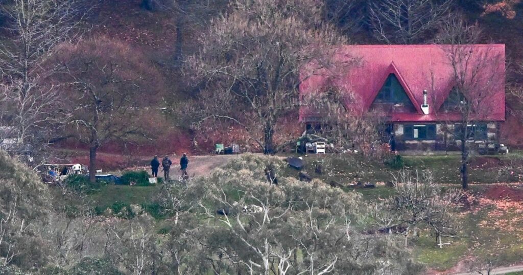 Police hunt Australian man believed to be radicalized, well-armed conspiracy theorist who killed 2 officers