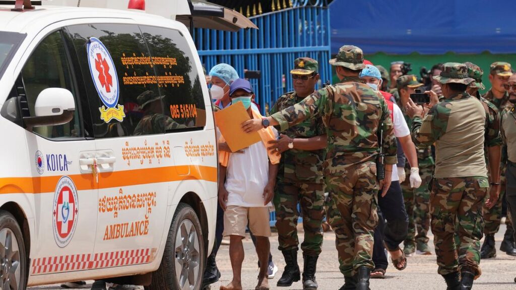 Thailand returns two wounded soldiers to Cambodia but continues to hold 18 of their comrades