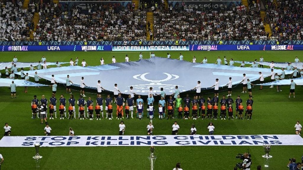 UEFA rolls out banner in support of children in war zones ahead of Super Cup