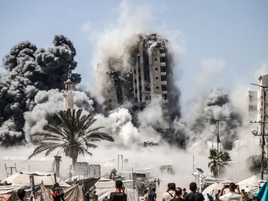 Israel blows up Gaza City high-rise, escalating deadly assault