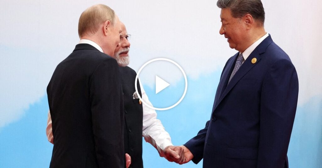 Putin and Modi Hold Hands as They Greet Xi