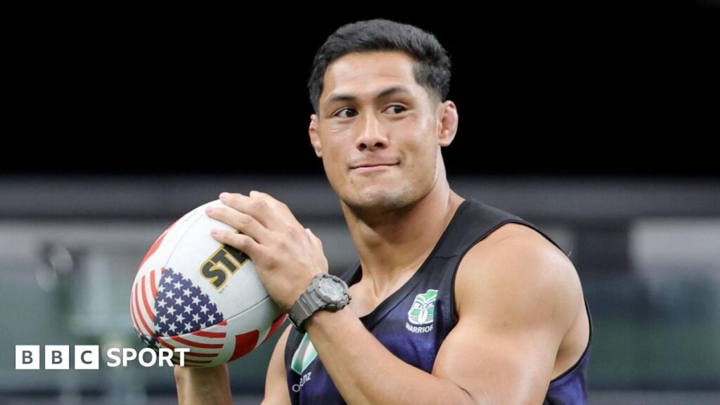 New Zealand Warriors' Roger Tuivasa-Sheck holds a rugby ball