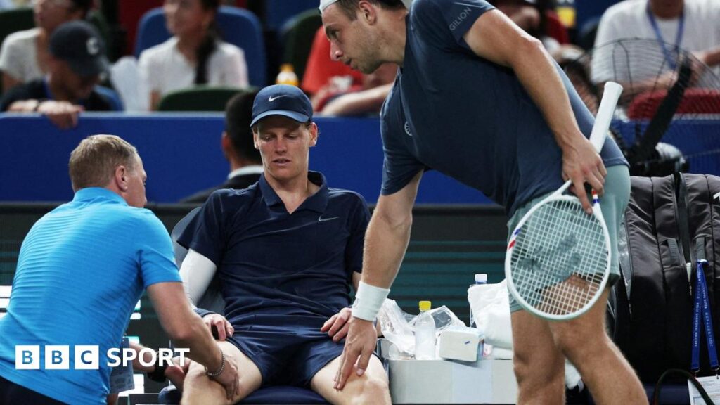 Shanghai Masters: Jannik Sinner retires as Novak Djokovic reaches last 16 Jannik Sinner receives medical treatment
