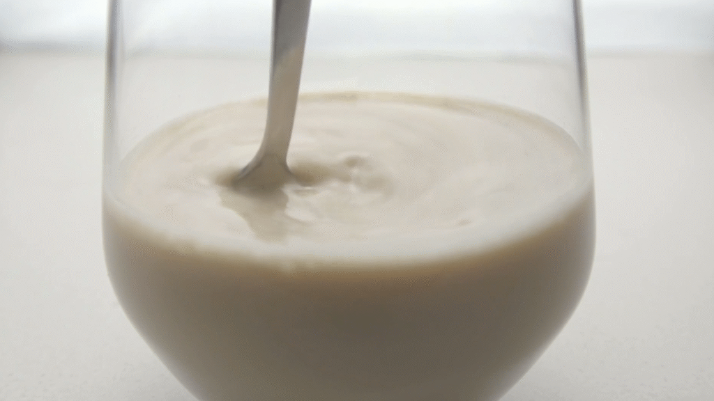 Why does stirring a liquid in a cup create a vortex?