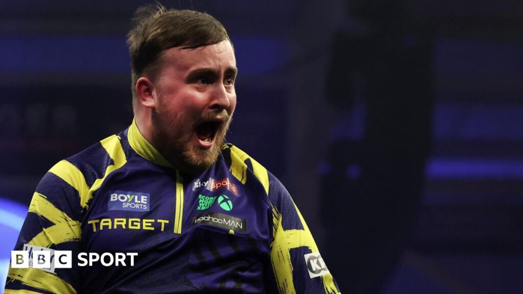 Luke Littler celebrates with his mouth wide open